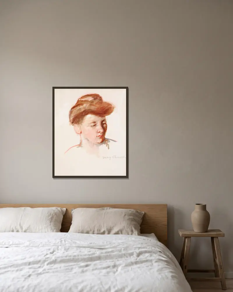 Skiss av moder Jeannes huvud, blick nedåt av Mary Cassatt inramad på en vägg