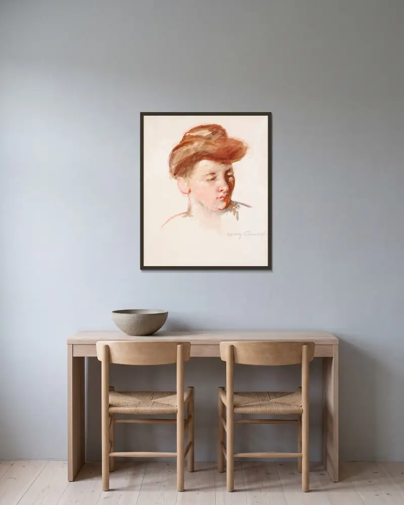 Skiss av moder Jeannes huvud, blick nedåt av Mary Cassatt inramad på en vägg