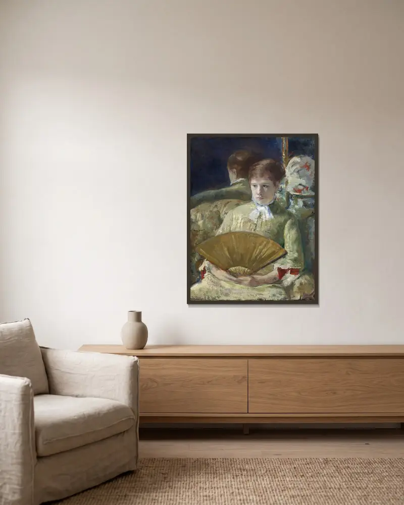 Kvinna med solfjäder av Mary Cassatt inramad på en vägg