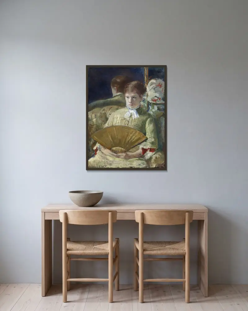 Kvinna med solfjäder av Mary Cassatt inramad på en vägg