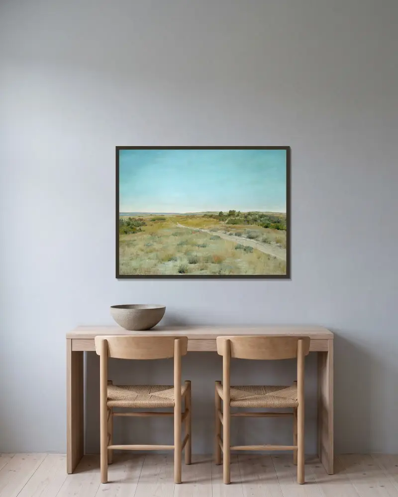 Första höstkänslan av William Merritt Chase inramad på en vägg