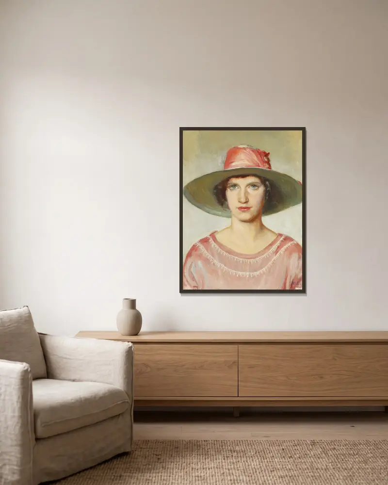 Porträt eines Mädchens in rosa Kleid und Strohhut mit rosa Band von Michael Ancher gerahmt an einer Wand