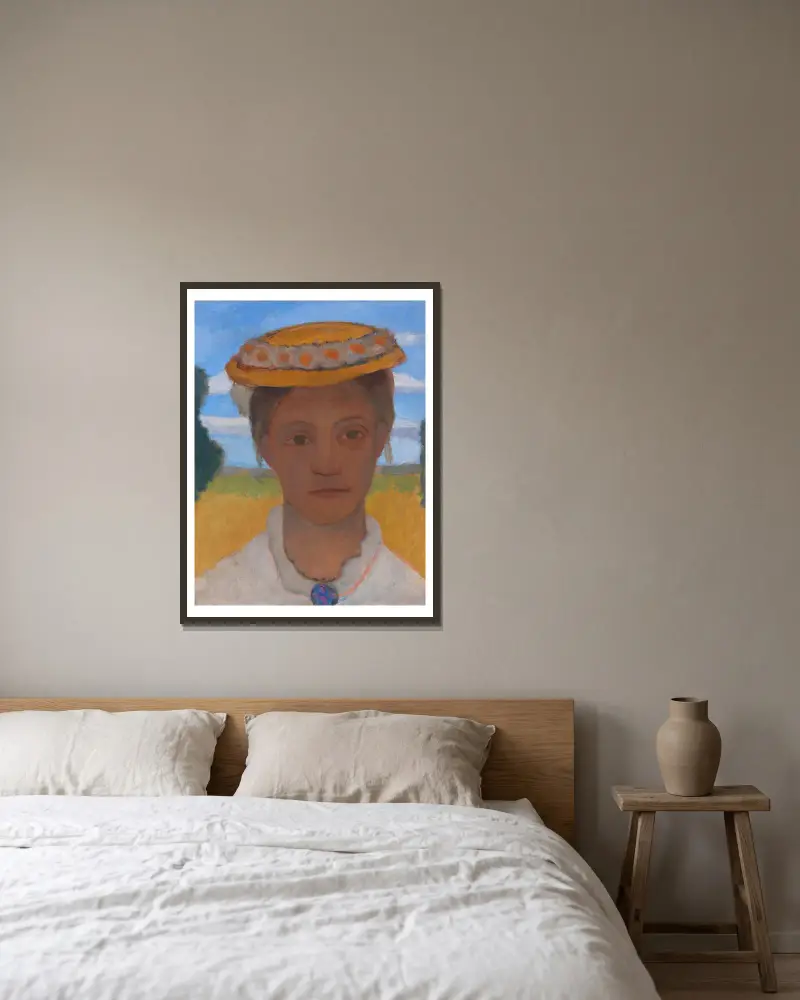 Systern Hermas huvud med prästkragskrans på hatten av Paula Modersohn-Becker inramad på en vägg