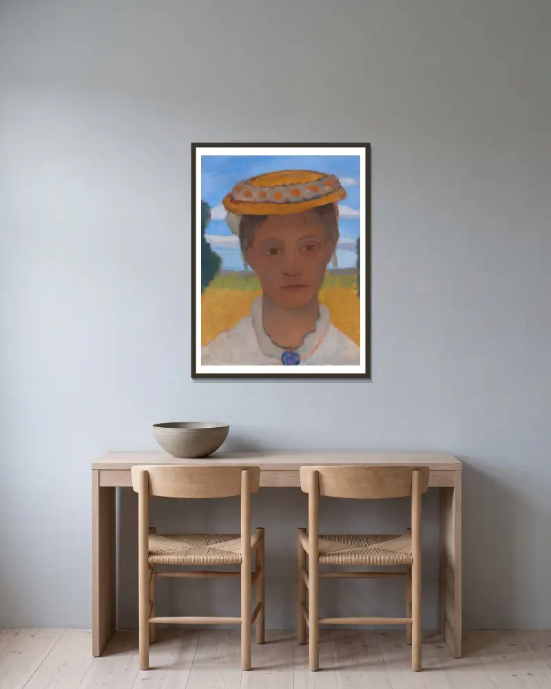 Systern Hermas huvud med prästkragskrans på hatten av Paula Modersohn-Becker inramad på en vägg