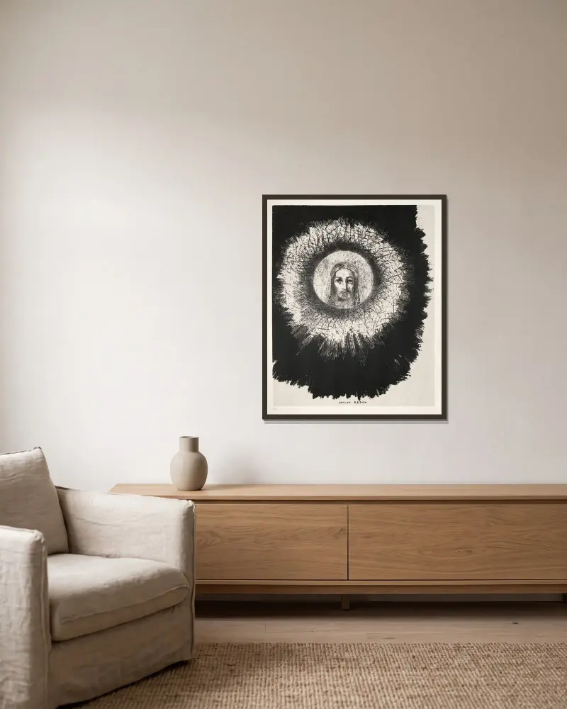 Och mitt i solens skiva lyser Jesu Kristi ansikte av Odilon Redon inramad på en vägg