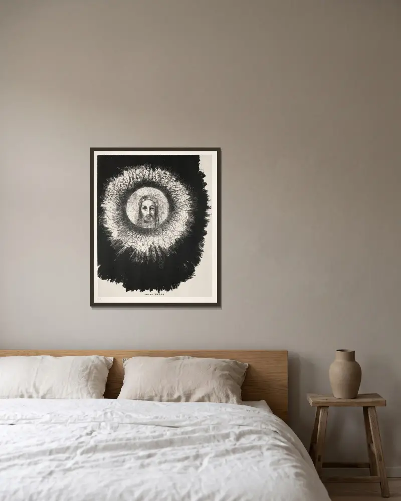 Och mitt i solens skiva lyser Jesu Kristi ansikte av Odilon Redon inramad på en vägg