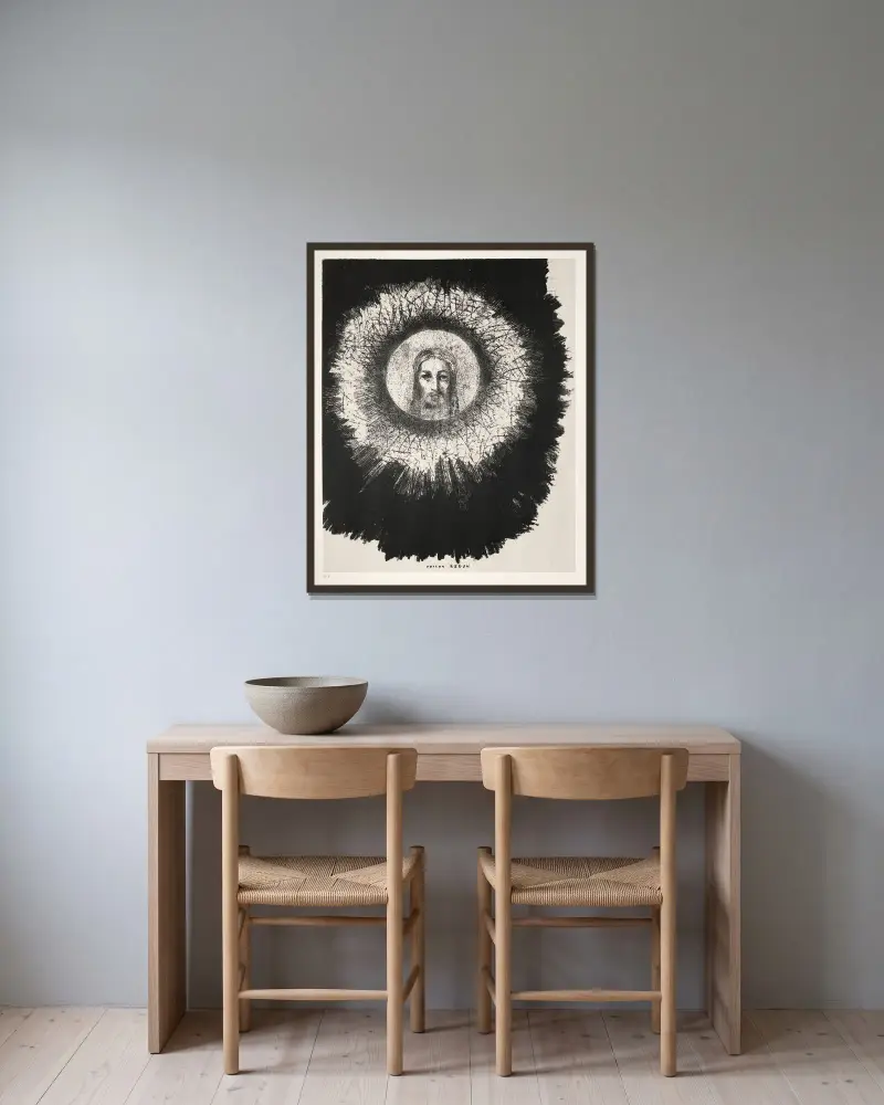 Och mitt i solens skiva lyser Jesu Kristi ansikte av Odilon Redon inramad på en vägg