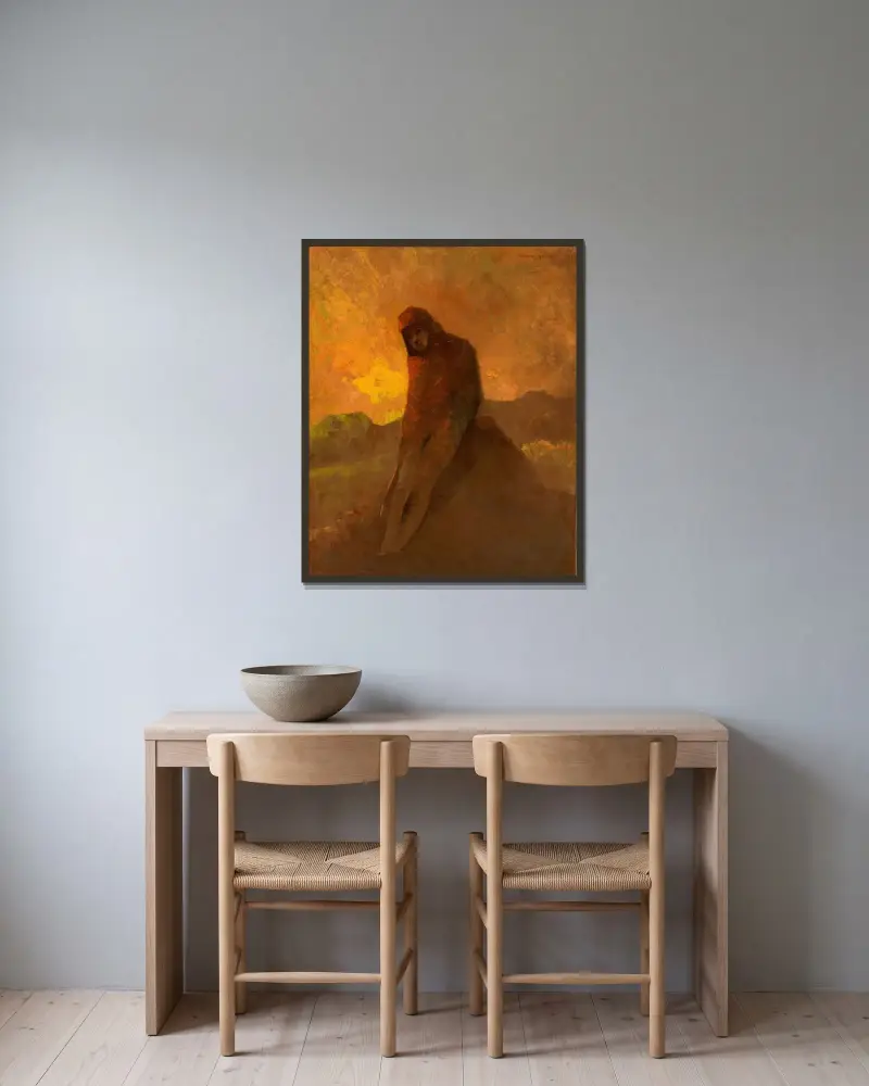 Rödklädd figur sittande på en klippa av Odilon Redon inramad på en vägg