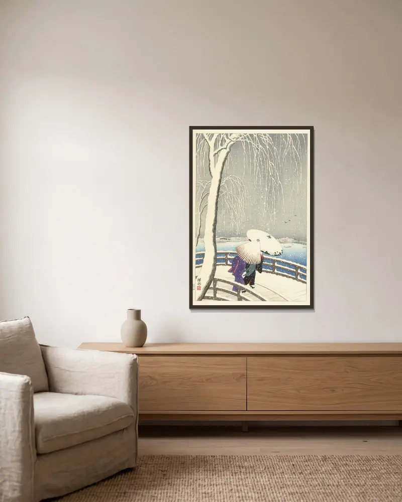 I snön vid Yanagibashi av Ohara Koson inramad på en vägg