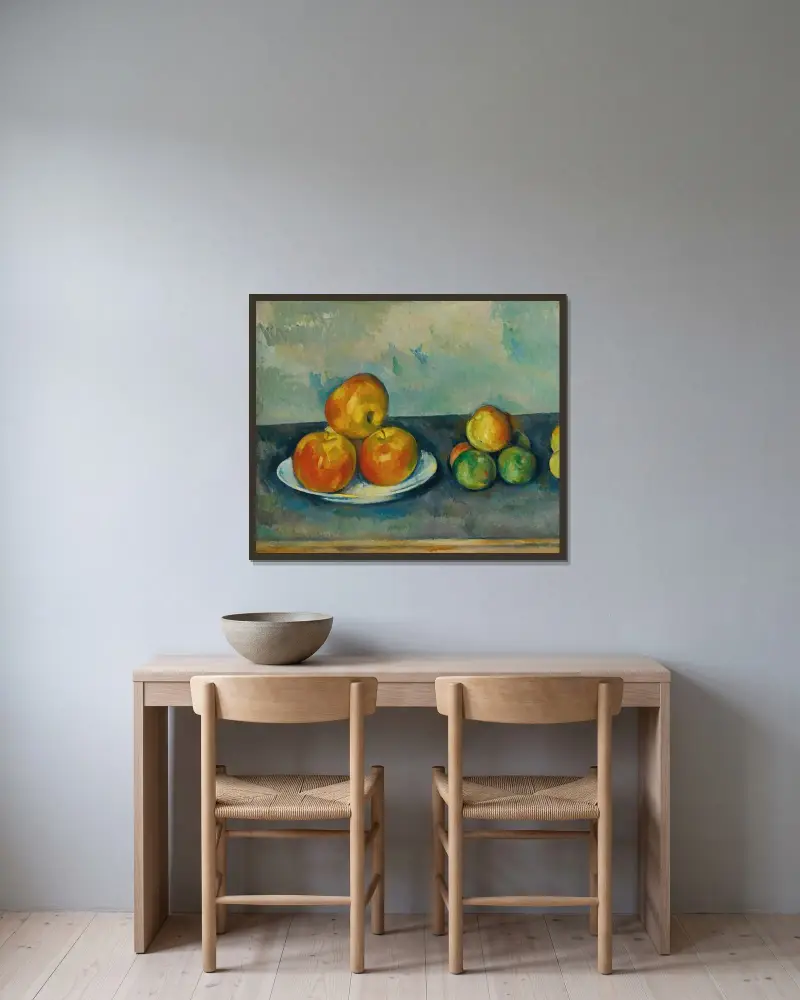 Les Pommes av Paul Cézanne inramad på en vägg