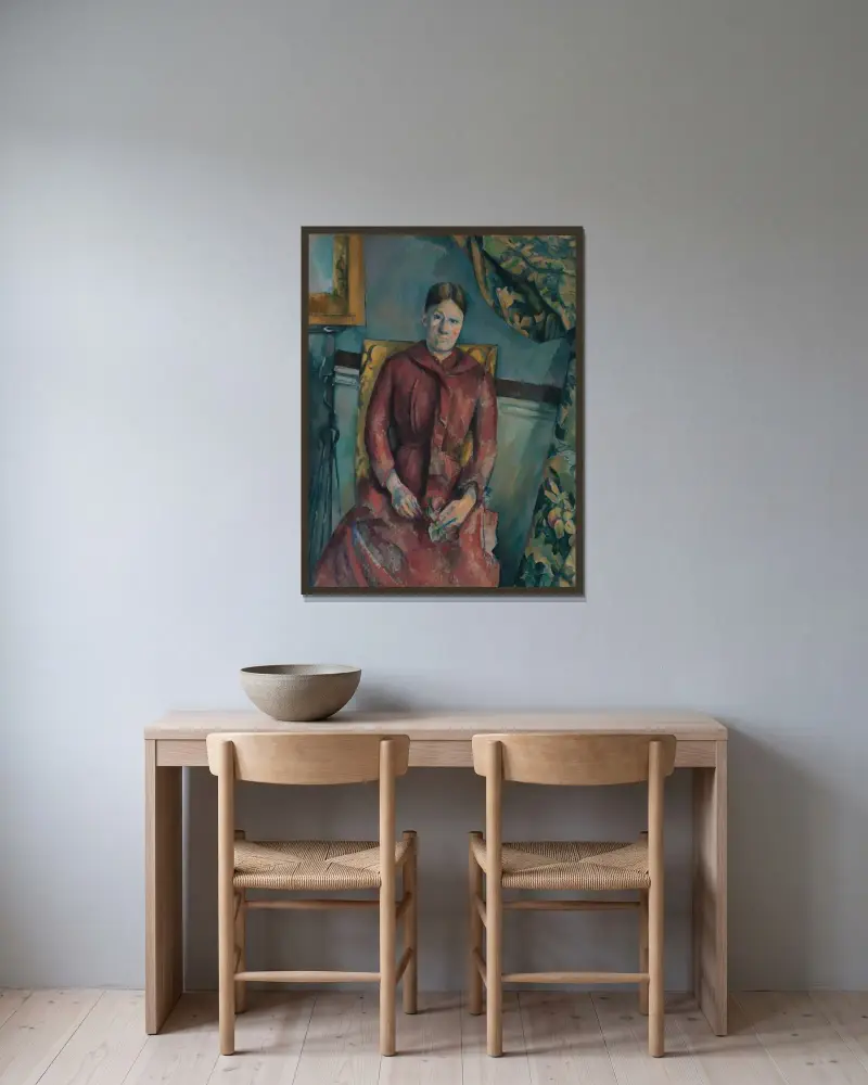 Madame Cézanne i röd klänning av Paul Cézanne inramad på en vägg