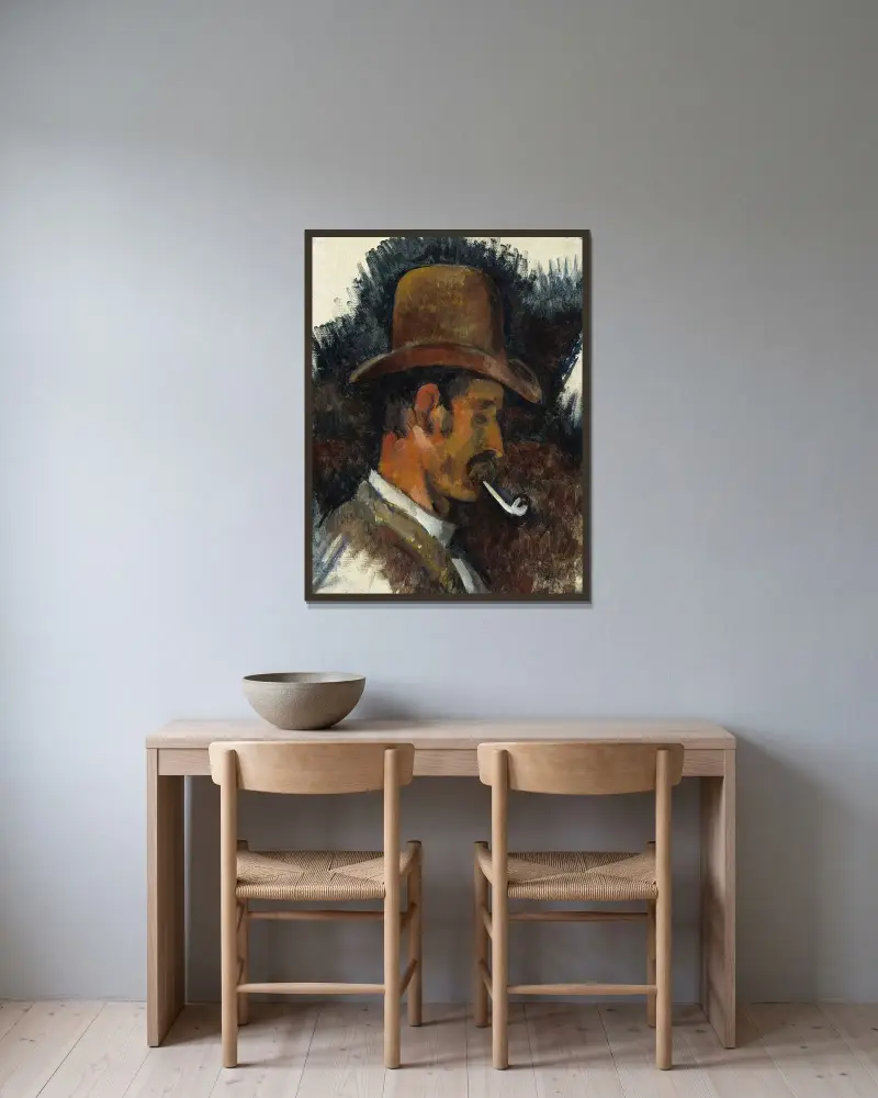 Man with Pipe av Paul Cézanne inramad på en vägg