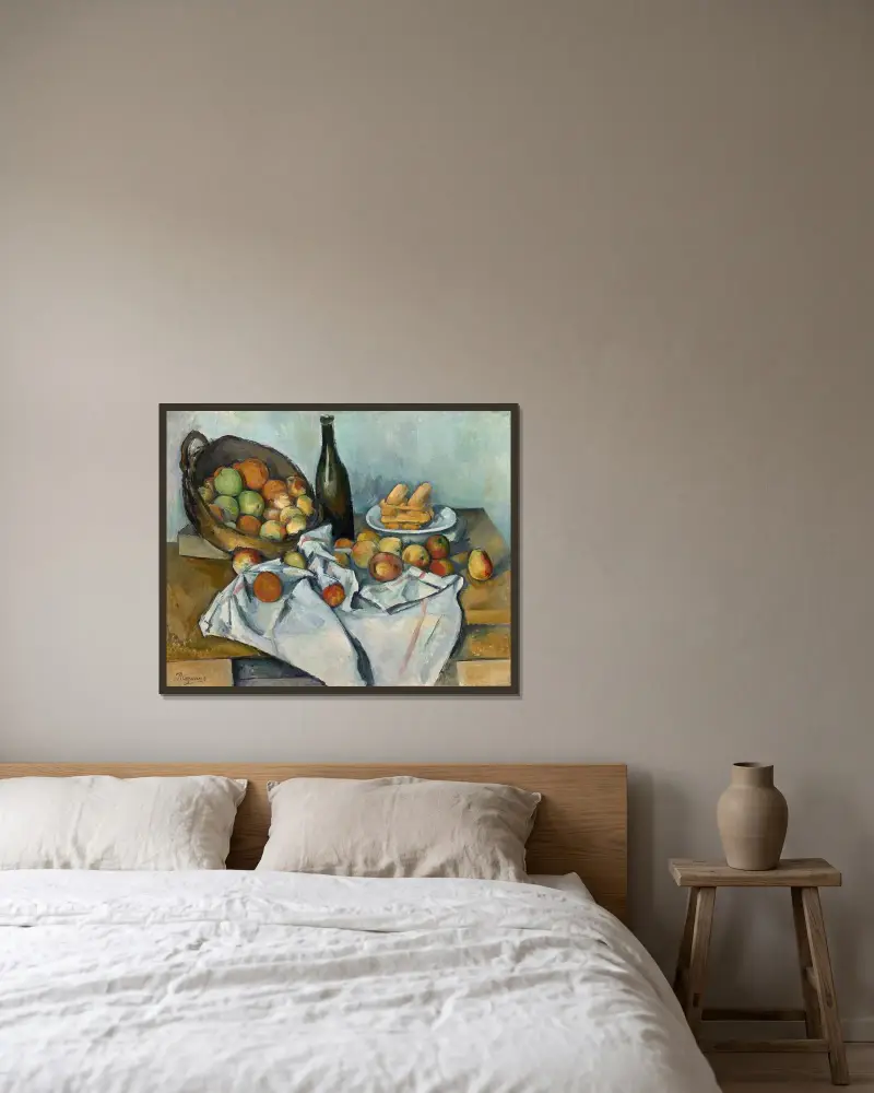 Korgen med äpplen av Paul Cézanne inramad på en vägg