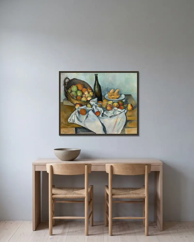 Korgen med äpplen av Paul Cézanne inramad på en vägg