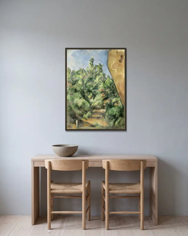The Red Rock av Paul Cézanne inramad på en vägg