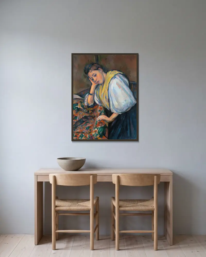 Young Italian Woman at a Table av Paul Cézanne inramad på en vägg