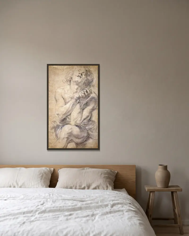 Sittande ung man (studie till Daniel) av Peter Paul Rubens inramad på en vägg