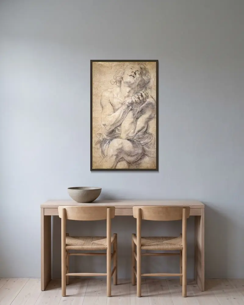 Sittande ung man (studie till Daniel) av Peter Paul Rubens inramad på en vägg