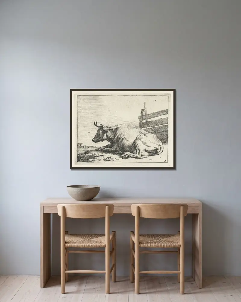 Liegende Kuh an einem Zaun von Paulus Potter gerahmt an einer Wand