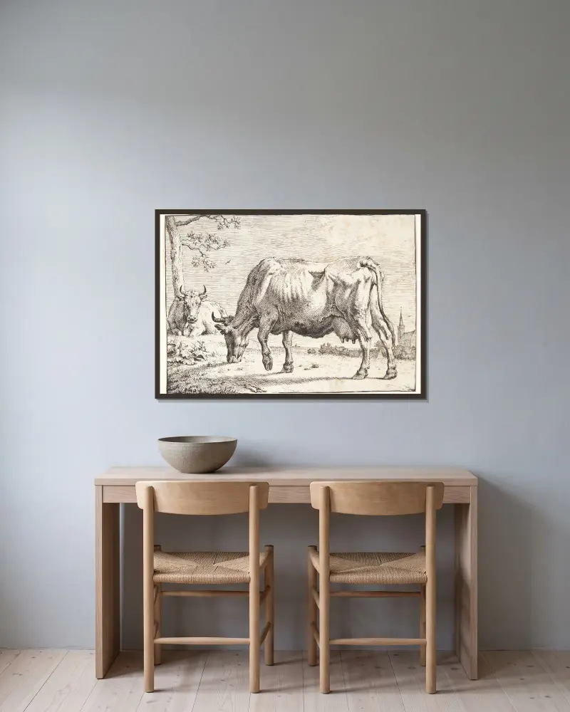 Weidende Kuh von Paulus Potter gerahmt an einer Wand