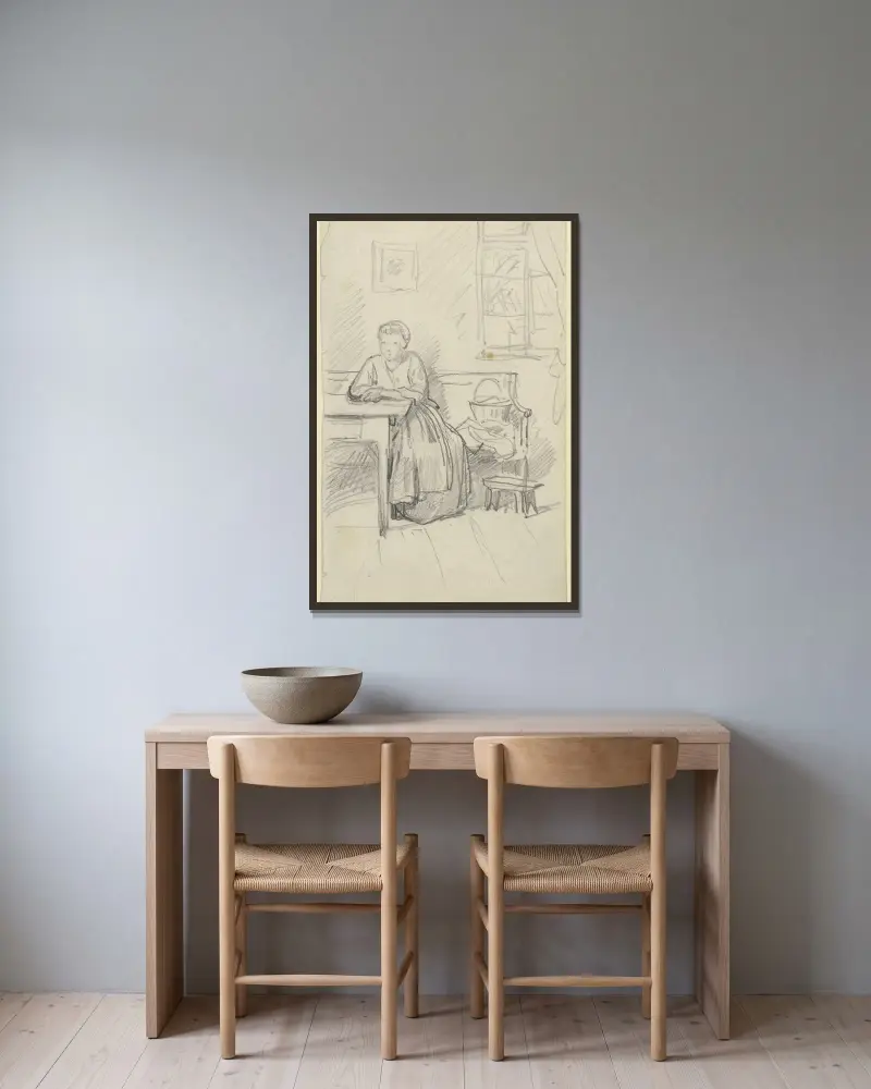Frau an einem Tisch sitzend von Philipp Rumpf gerahmt an einer Wand