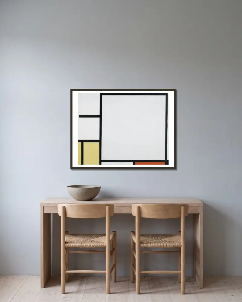 Komposition mit Blau, Rot, Gelb und Schwarz von Piet Mondrian gerahmt an einer Wand