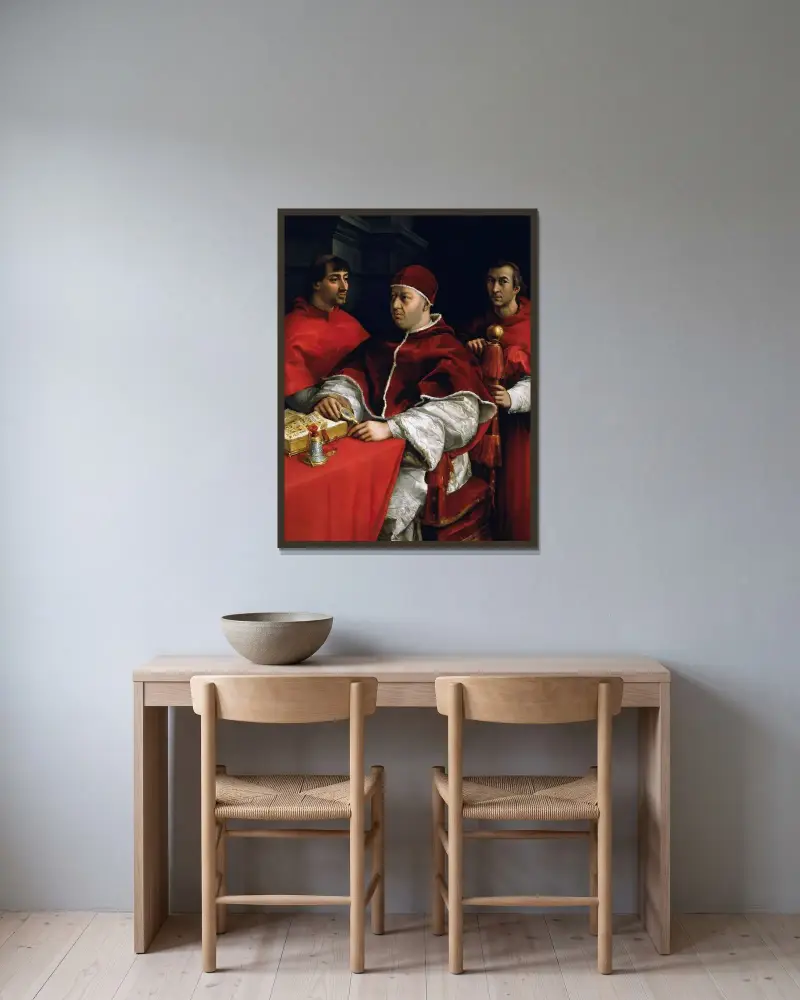 Portrait of Pope Leo X with Cardinals Giulio de’ Medici and Luigi de’ Rossi von Raphael gerahmt an einer Wand