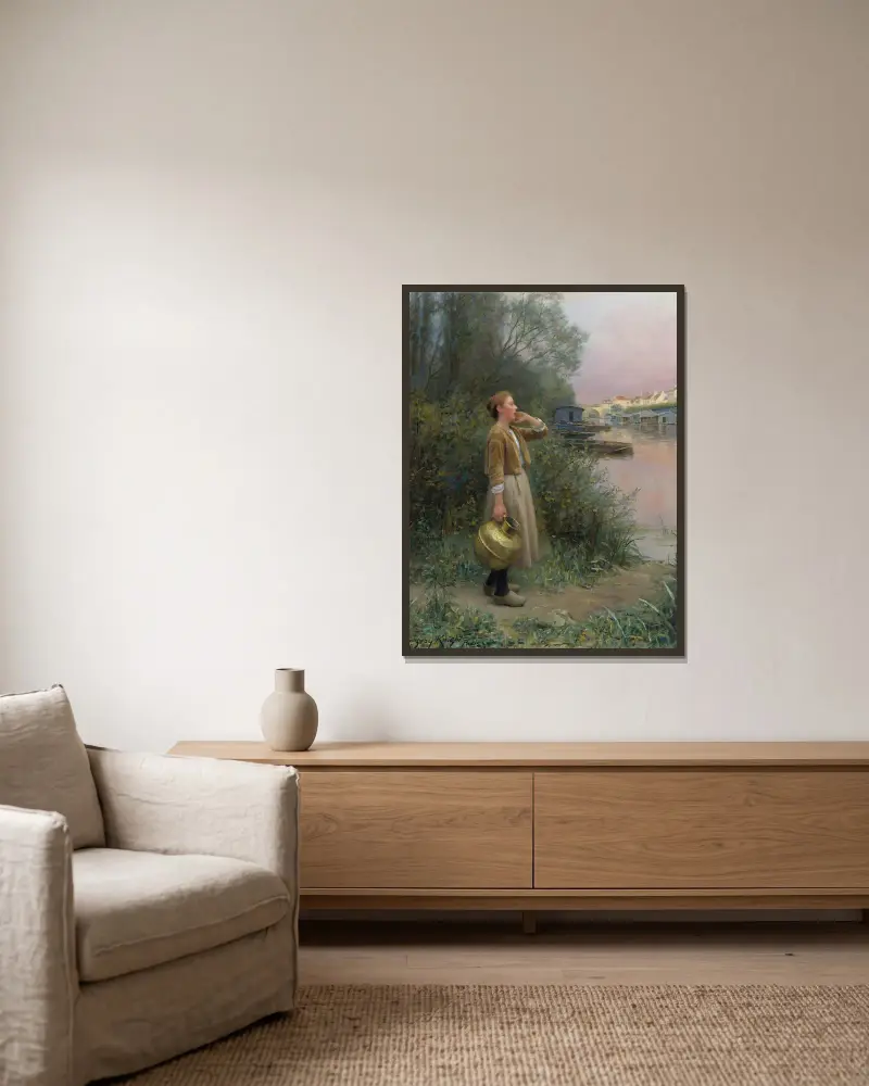 Flicka med vattenkruka av Daniel Ridgway Knight inramad på en vägg