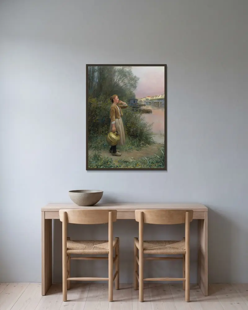 Flicka med vattenkruka av Daniel Ridgway Knight inramad på en vägg