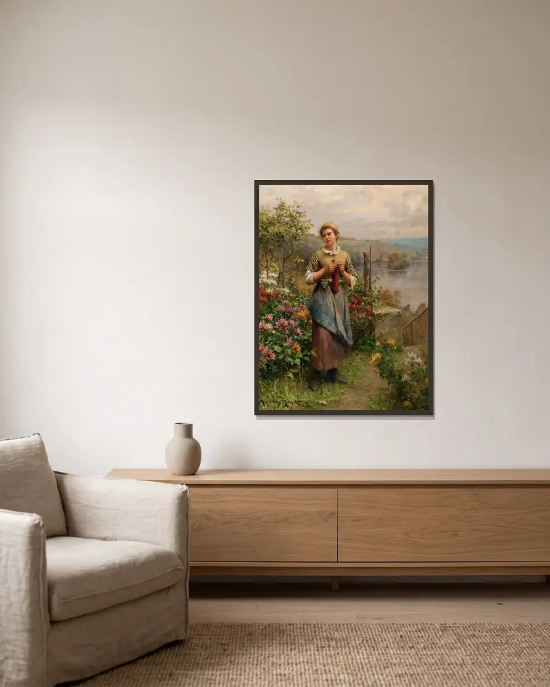 Ung kvinna som stickar av Daniel Ridgway Knight inramad på en vägg