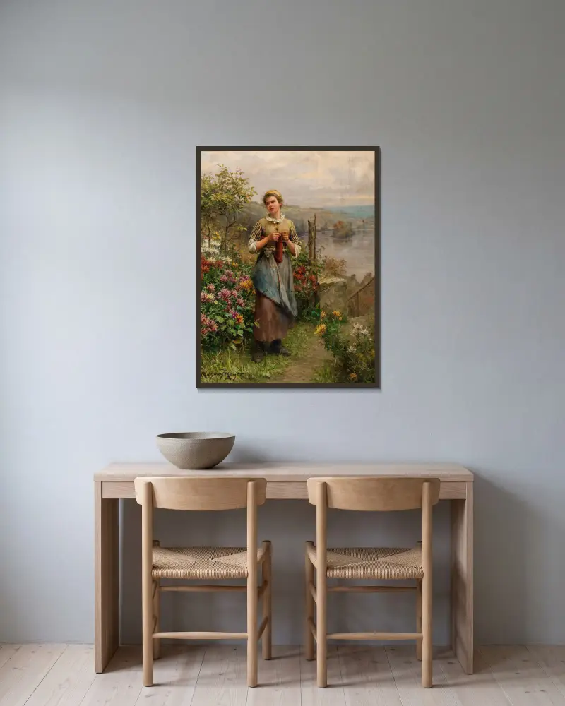 Ung kvinna som stickar av Daniel Ridgway Knight inramad på en vägg