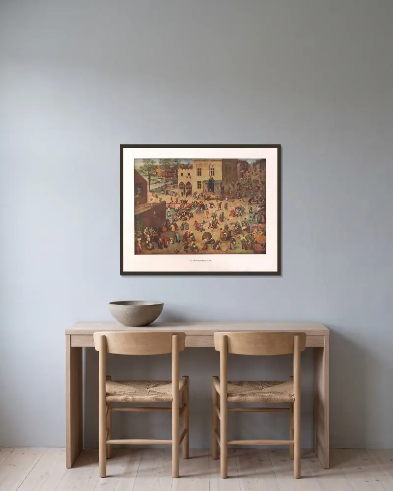 Die Kinderspiele av Pieter Bruegel The Elder inramad på en vägg