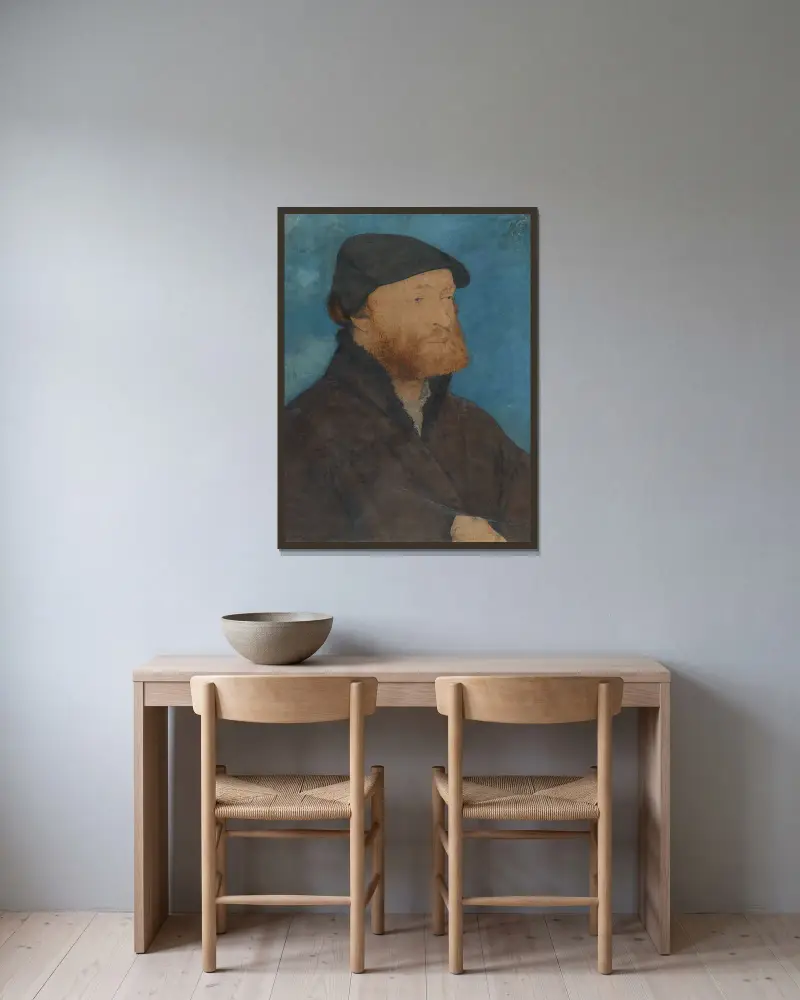 Bildnis eines Mannes mit schwarzem Barett von Hans Holbein The Younger gerahmt an einer Wand