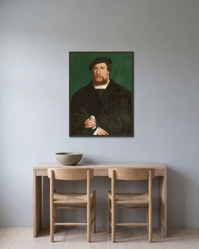 Porträt eines hanseatischen Kaufmanns von Hans Holbein The Younger gerahmt an einer Wand