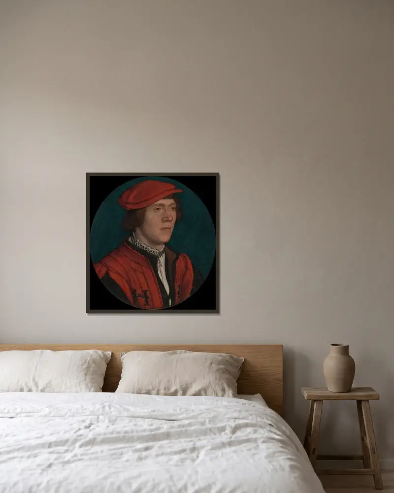 Porträtt av en man i röd mössa av Hans Holbein The Younger inramad på en vägg