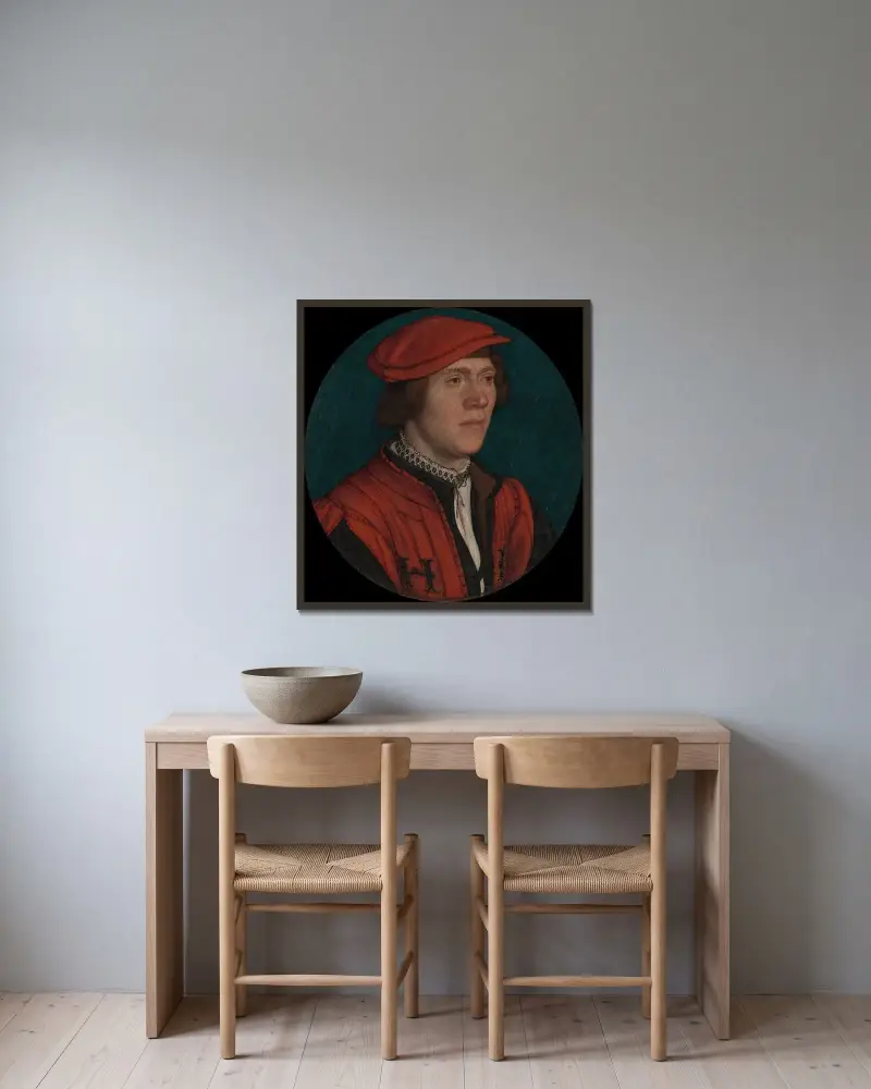 Porträtt av en man i röd mössa av Hans Holbein The Younger inramad på en vägg