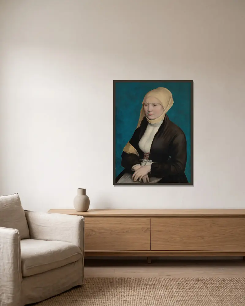 Porträtt av en kvinna från södra Tyskland av Hans Holbein The Younger inramad på en vägg