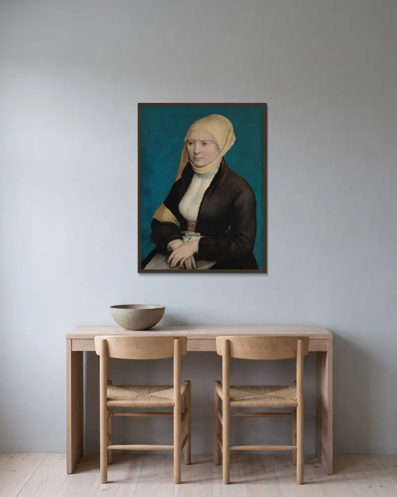 Porträtt av en kvinna från södra Tyskland av Hans Holbein The Younger inramad på en vägg