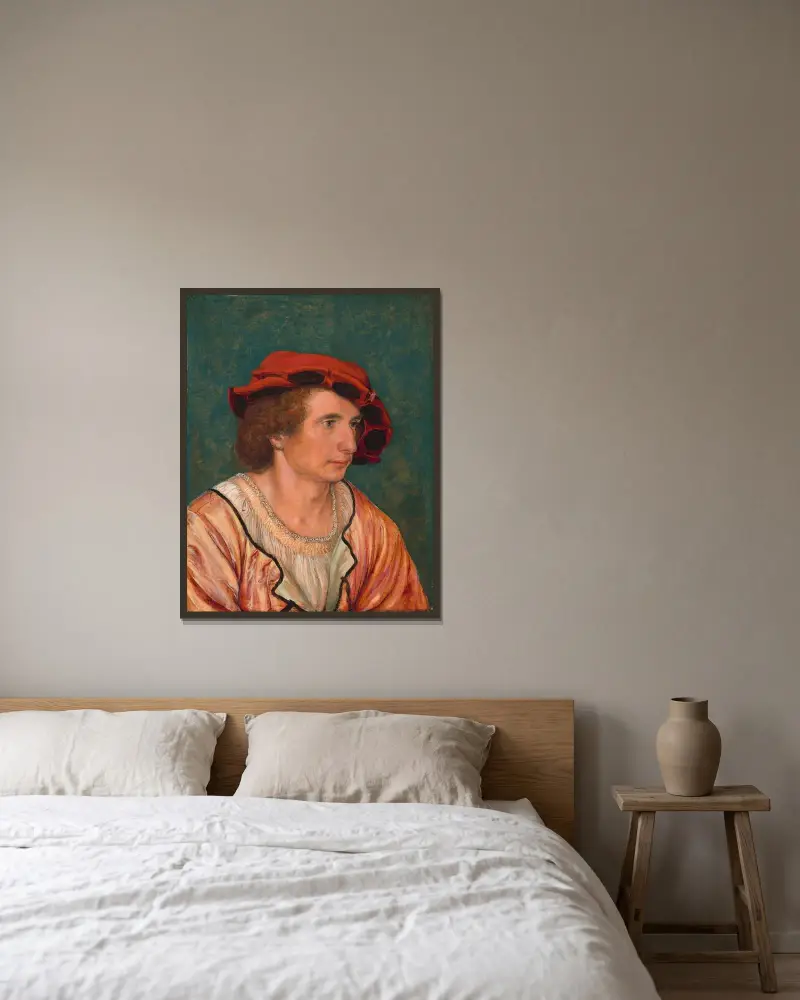 Porträtt av en ung man av Hans Holbein The Younger inramad på en vägg