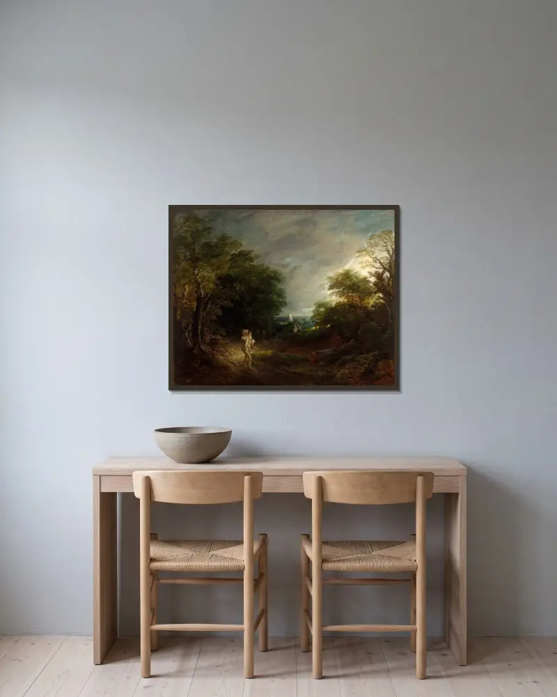 Skogslandskap med vedhuggare av Thomas Gainsborough inramad på en vägg