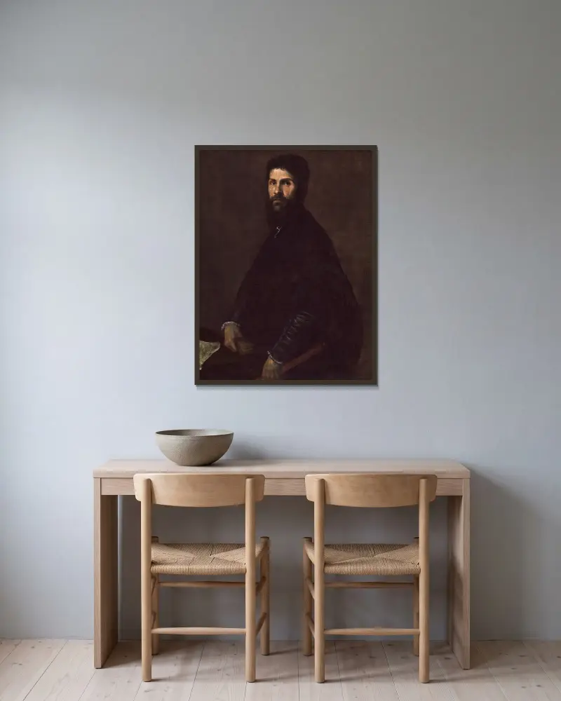 Man Holding a Flute av Titian inramad på en vägg
