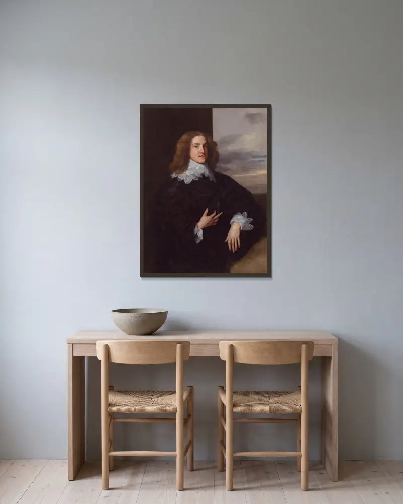 Bildnis eines jungen Edelmanns von Anthony van Dyck gerahmt an einer Wand