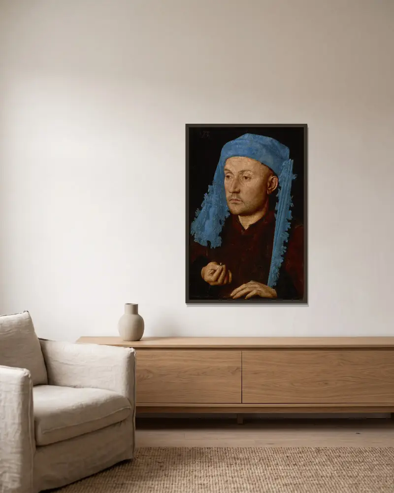 Man in a Blue Cap av Jan van Eyck inramad på en vägg