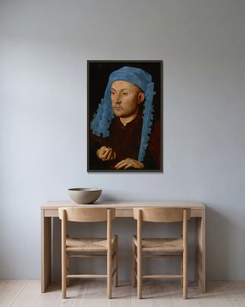 Man in a Blue Cap av Jan van Eyck inramad på en vägg