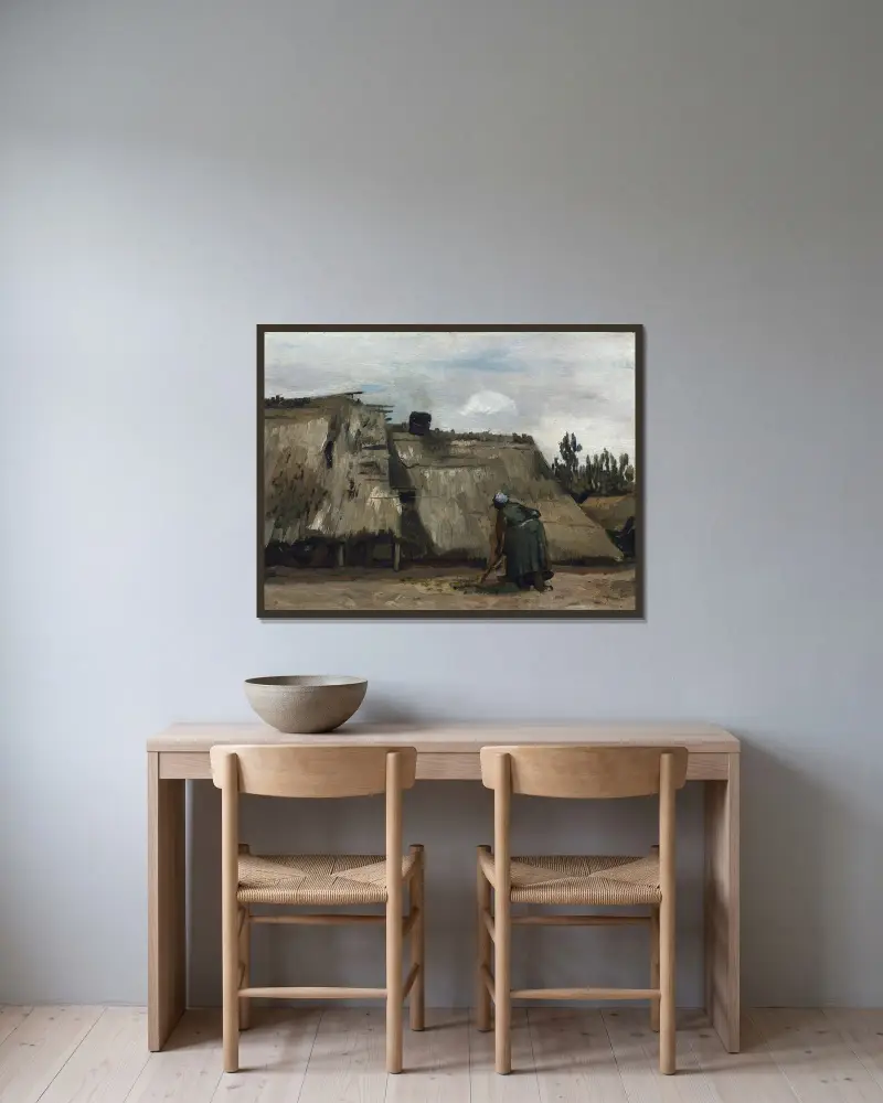 Bondkvinna som gräver framför sin stuga av Vincent van Gogh inramad på en vägg