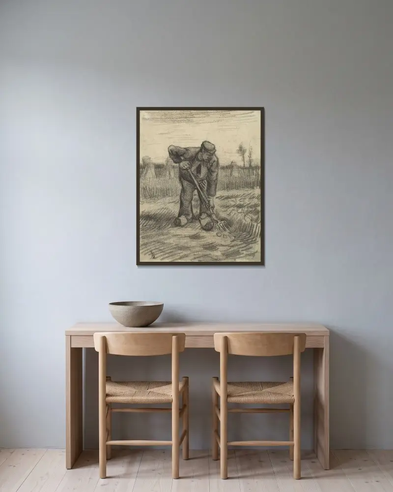 Aardappelrooier av Vincent van Gogh inramad på en vägg