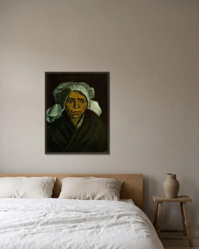 Head of a Peasant Woman av Vincent van Gogh inramad på en vägg