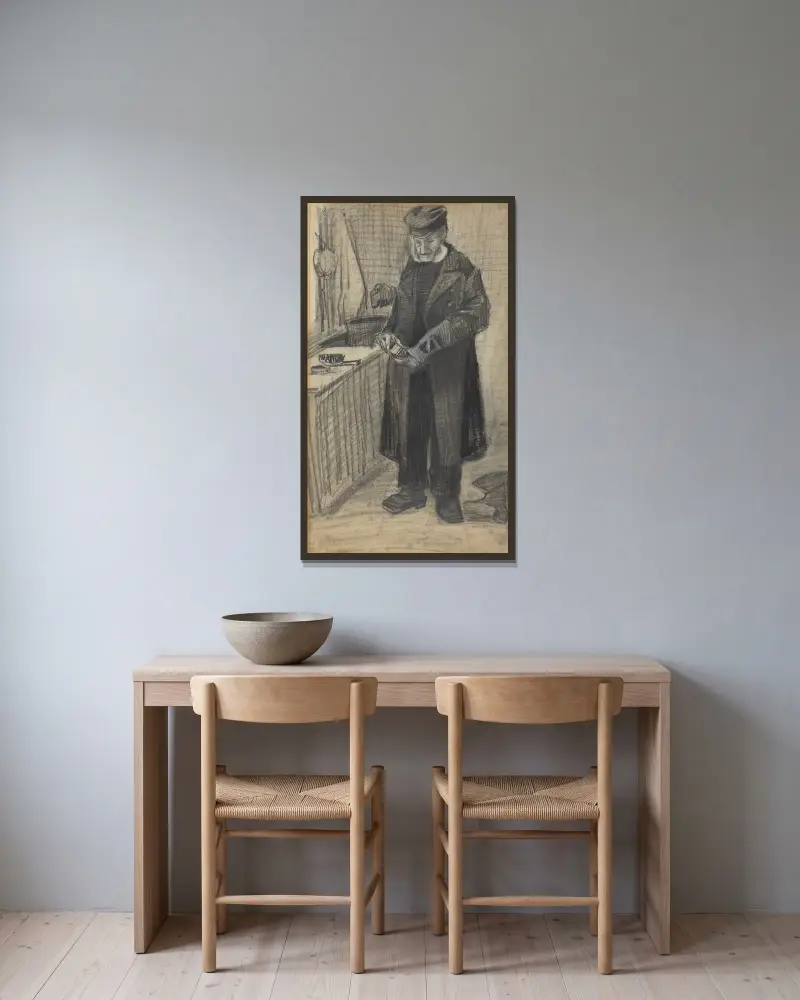 Mann beim Stiefelputzen von Vincent van Gogh gerahmt an einer Wand