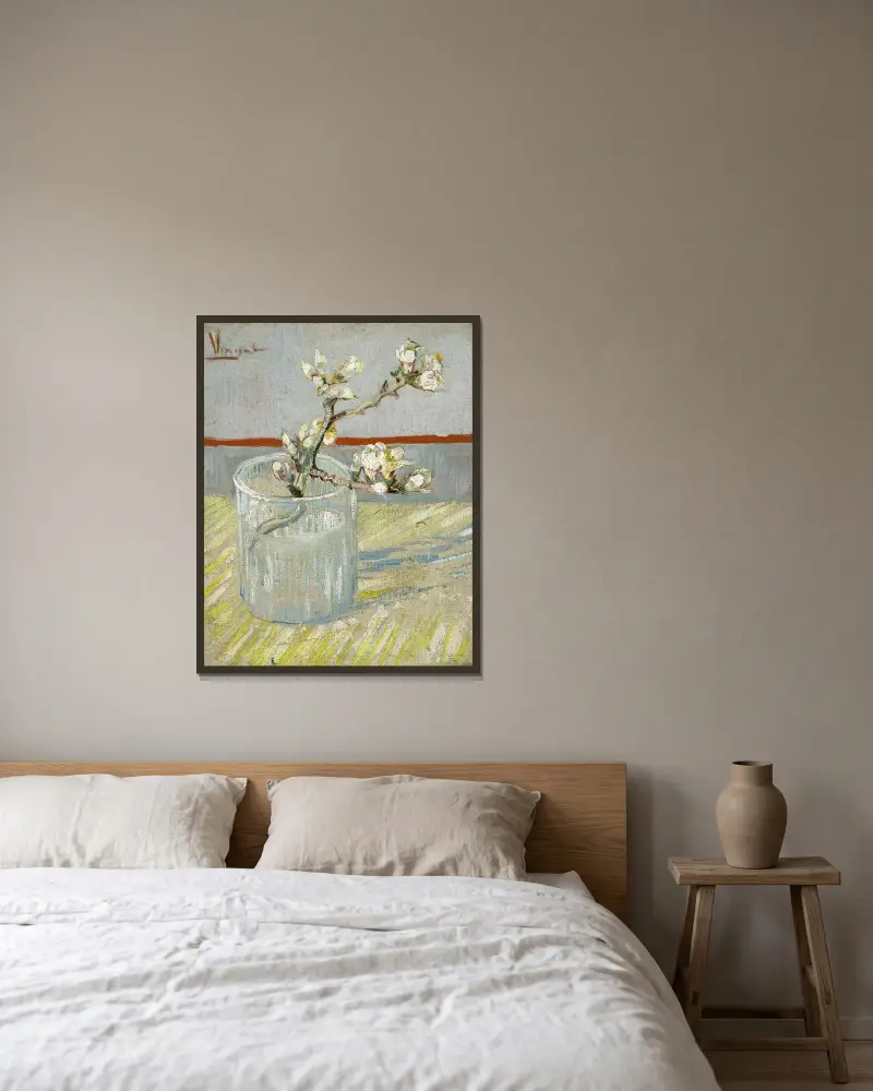 Sprig of flowering almond in a glass av Vincent van Gogh inramad på en vägg