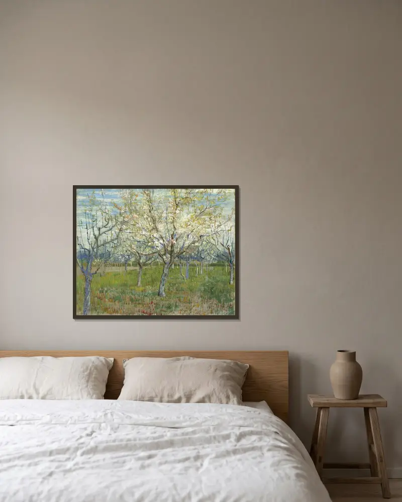The Pink Orchard av Vincent van Gogh inramad på en vägg